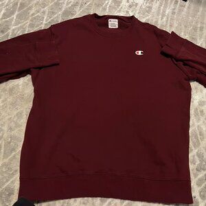Men’s burgundy embroidered champion Crewneck in a size XL